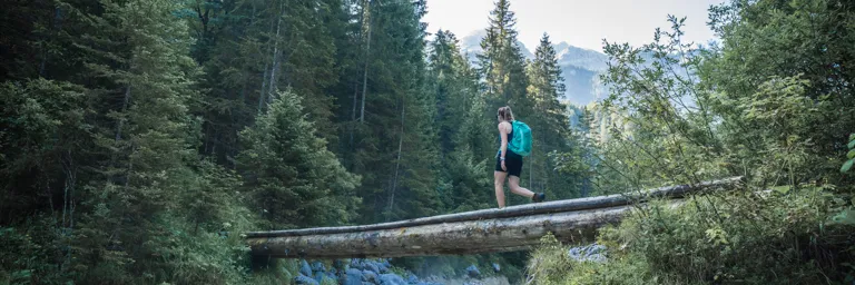 Nikwax Woman Walking In Forest Backpack 768px